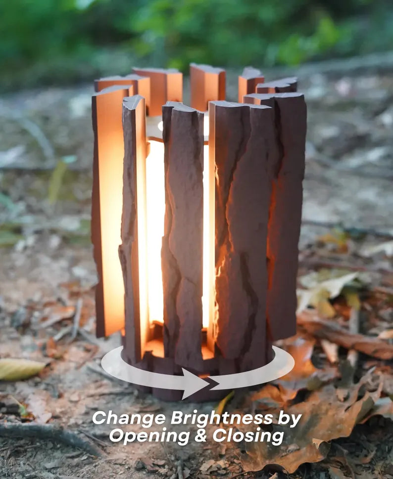 Log Table Lamp in brown on a wooden table, showcasing its unique design and natural wood-like texture by Loffa Design. Loffadesign